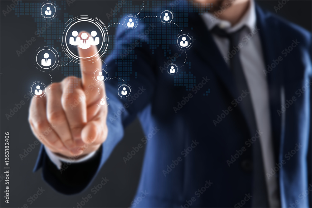 Targeting, recruitment, customer acquisition. Businessman touching virtual screen with scheme of human icons and world map against dark grey background, closeup Targeting, recruitment, customer acquisition. Businessman touching virtual screen with scheme of human icons and world map against dark grey background, closeup