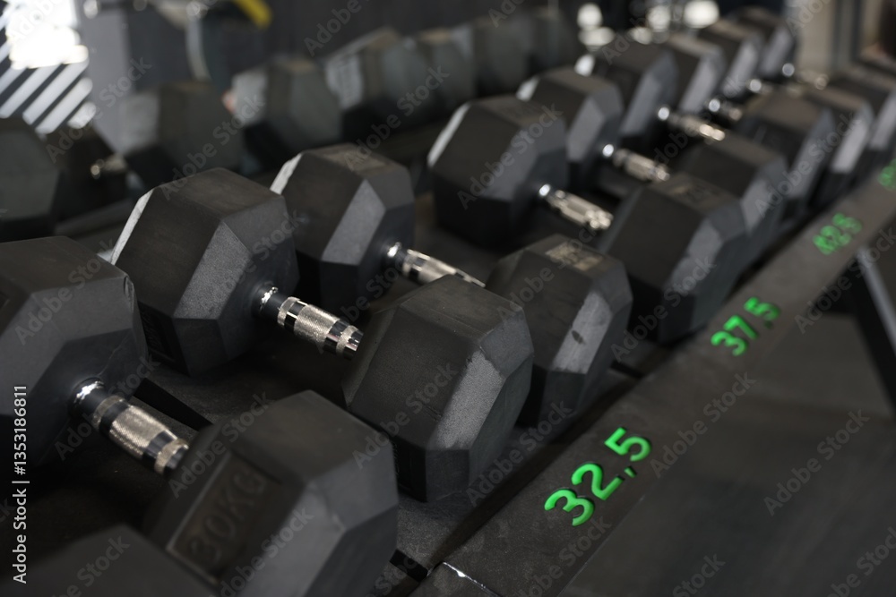 Obraz premium Different many dumbbells in gym. Sport equipment