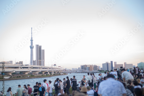 Photography scenery with tokyo sky tree and a lot of people gathering at riverside of shioir