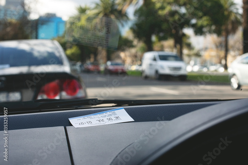 Parking ticket placed on car dashboard in Melbourne inner city