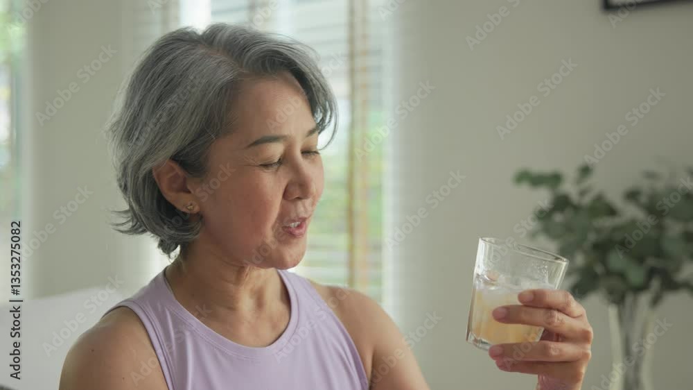 Asia adult people middle age happy old woman pour weight loss tea fiber juice drink kombucha gut health care diet detox sit at home sofa elder aging asian aged female. Fresh bottle medical food relief Asia adult people middle age happy old woman pour weight loss tea fiber juice drink kombucha gut health care diet detox sit at home sofa elder aging asian aged female. Fresh bottle medical food relief