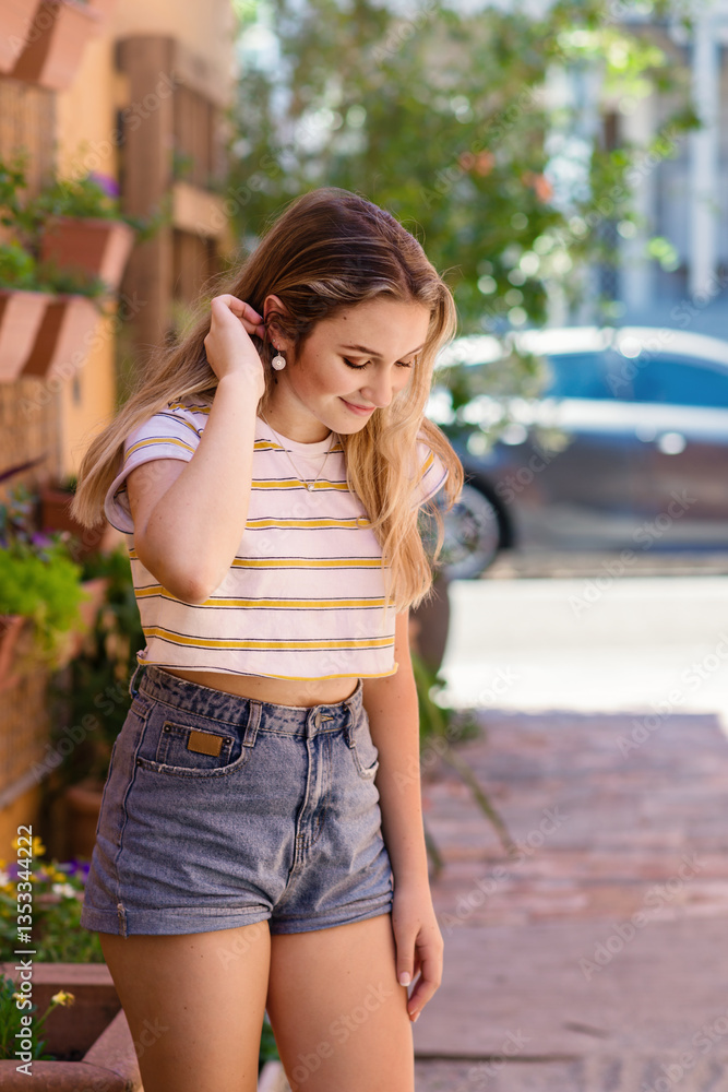 teen with hands in hair