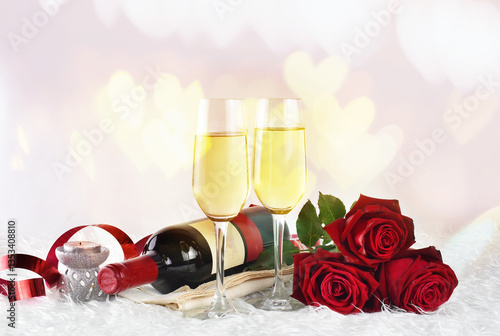Valentines day background with champagne glasses and red roses	