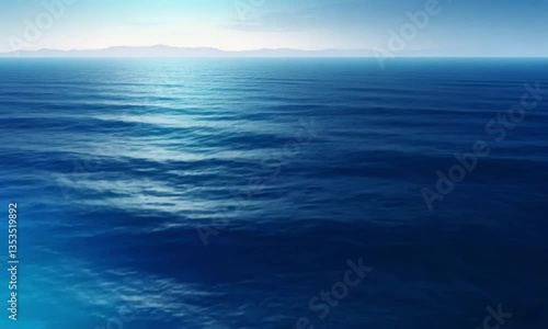 Serene ocean waves gently moving under soft light, creating a peaceful and calming seascape.