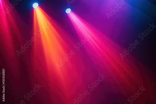 Colorful stage lights project vibrant beams across the darkened space