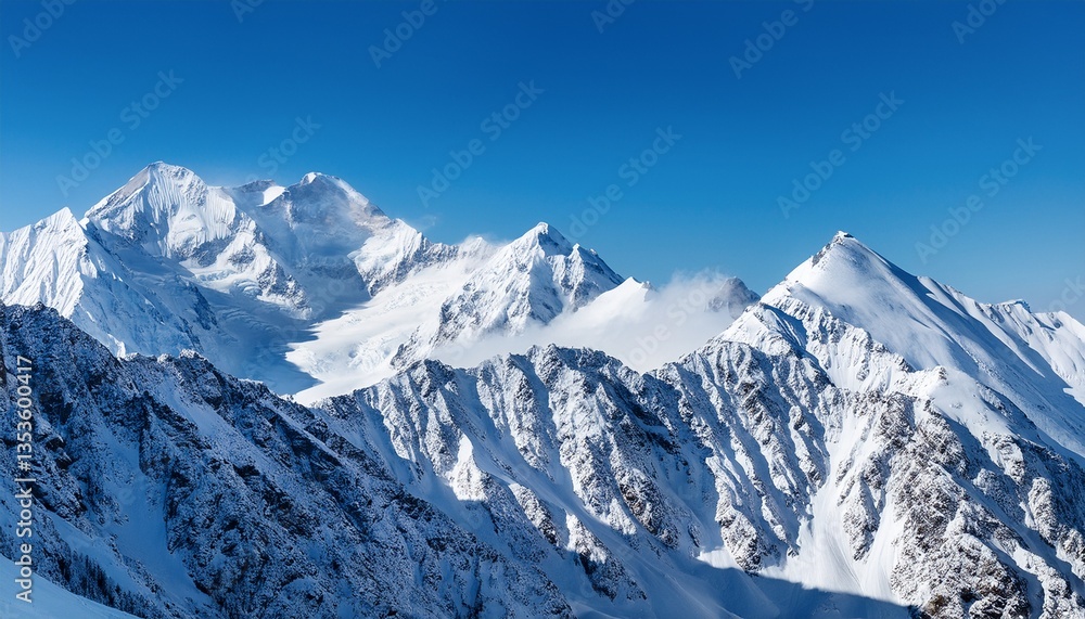 a snowy mountain range with a clear blue sky a snowy mountain range with a clear blue sky