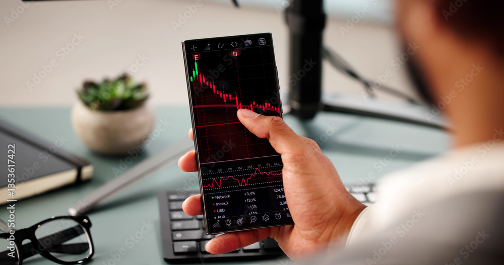 Young black businessman trading stocks online