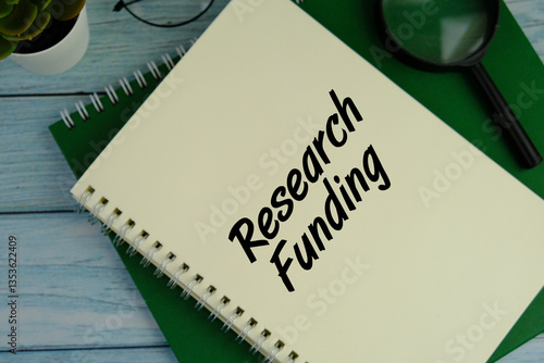 Research funding on white paper background 