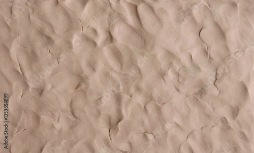 Brown plasticine texture background. Modeling clay material pattern.
