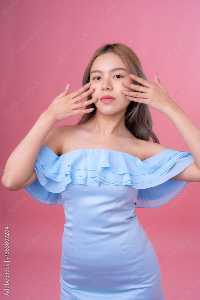 The enchanting studio shot of a female model with long hair showcases an exquisite fashion look, her presence further accentuated by the soft, pastel pink background, enhancing her grace. The enchanting studio shot of a female model with long hair showcases an exquisite fashion look, her presence further accentuated by the soft, pastel pink background, enhancing her grace.