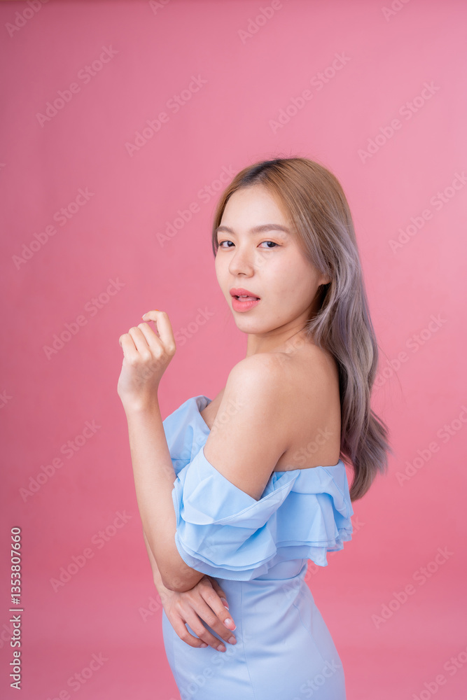With a confident gaze, the female model stands in a high-quality studio shot, her presence enhanced by the gentle pink background, making it perfect for an engaging advertisement or a sleek website. With a confident gaze, the female model stands in a high-quality studio shot, her presence enhanced by the gentle pink background, making it perfect for an engaging advertisement or a sleek website.