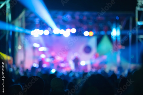 Fotografija Silhouettes of concert crowd with stage lights, out of focus blu