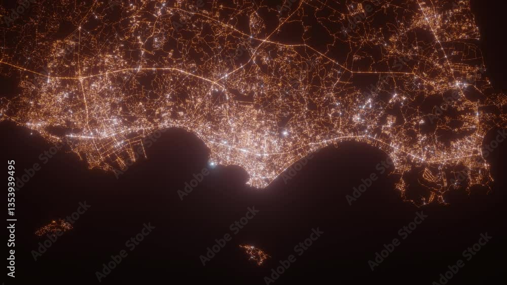 Pattaya (Thailand) top view at night. Aerial view on modern city with lights. Camera is flying above the city, moving backward. Vertical video. The north is on the left side