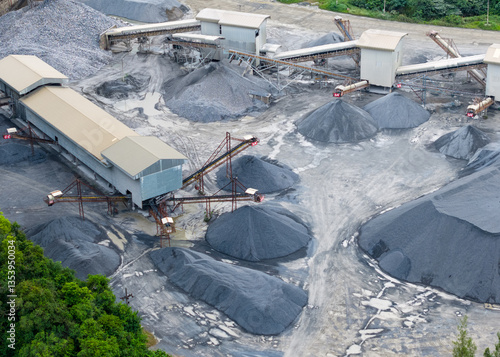 фотографія Mining operation from above, showing machinery and mounds of extracted resources