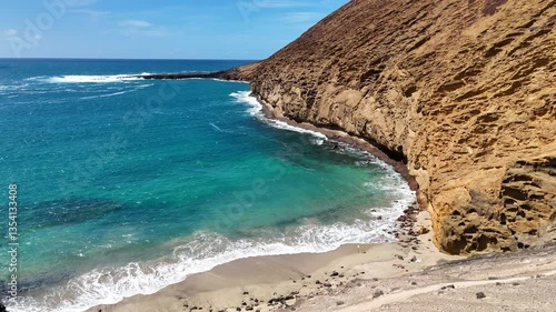 La Graciosa, Lanzarote Aerial View. Playa La Cocina near Montaña Amarilla. Volcanic landscape of La Graciosa island with dramatic coastal cliffs and the Atlantic Ocean. Canary Islands. Spain. 
