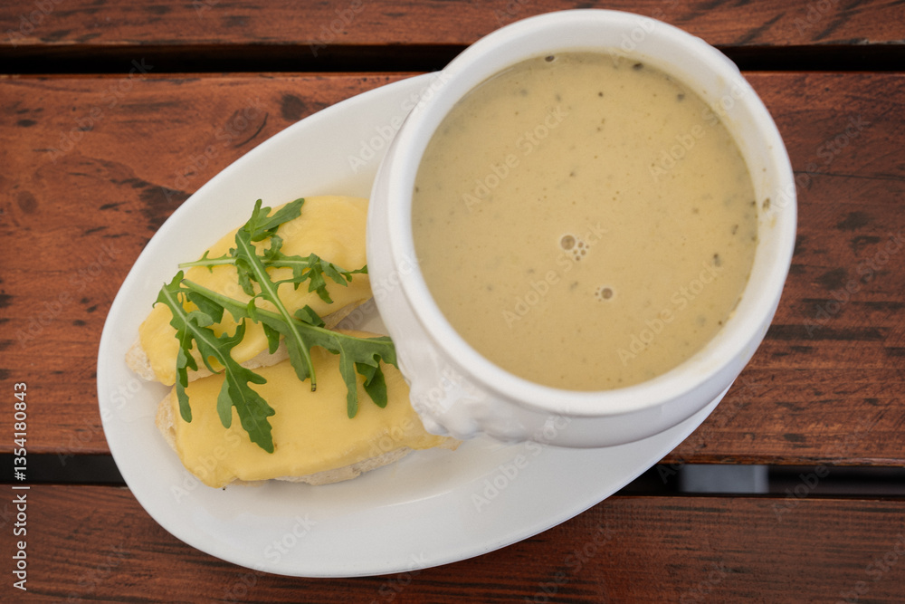 Garlic soup with grilled cheese sandwich in Polish mountains cafe, Gubałówka, Zakopane, Poland. Garlic soup with grilled cheese sandwich in Polish mountains cafe, Gubałówka, Zakopane, Poland.