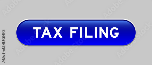 Blue color capsule shape button with word tax filing on gray background
