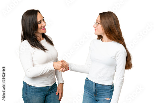 mother and daughter over isolated chroma key background handshaking after good deal