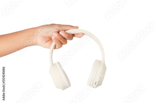 A person is holding a pair of headphones isolated on white background