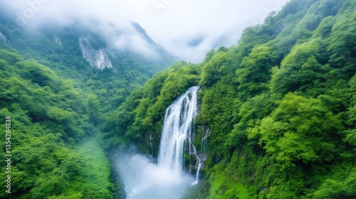 Lush waterfall cascading down misty mountains. Verdant forests surround the serene scene