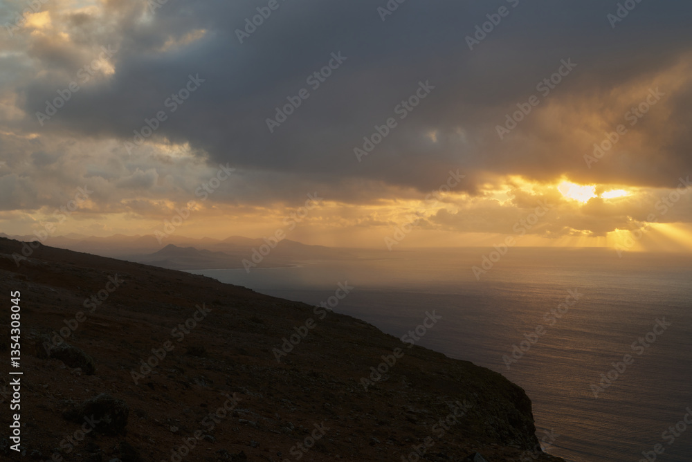 Sunset from a panoramic viewpoint Mirador del Rio above the island of Graciosa in Lanzarote, Spain Sunset from a panoramic viewpoint Mirador del Rio above the island of Graciosa in Lanzarote, Spain