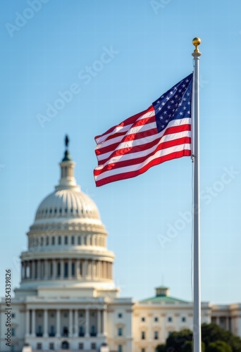 American flag waving in front of the u.s. capitol building, symbolizing patriotism and democracy against a clear blue sky.