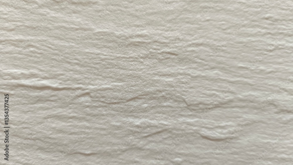 Naklejka premium The rough, stone-like texture of the wall tiles is a multi-patterned, cream-white horizontal wave pattern.