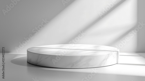 White marble round podium in sunlit room.