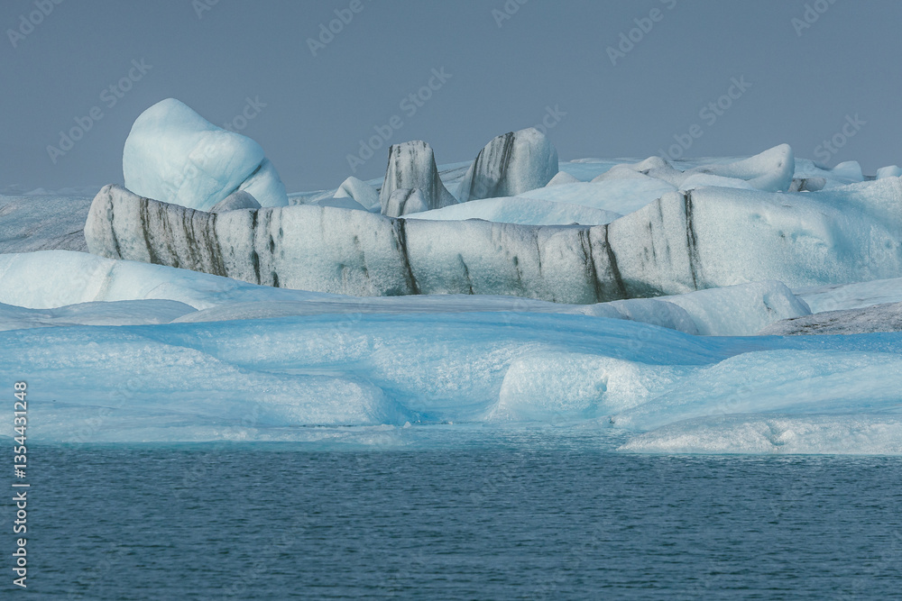 Glacial mountains in Iceland, showcasing rugged peaks and icy landscapes. A breathtaking view of nature's raw power, shaped by time and elements. Perfect for travel, adventure, and nature themes.