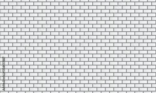 Seamless pattern of white bricks on a gray background arranged in a grid