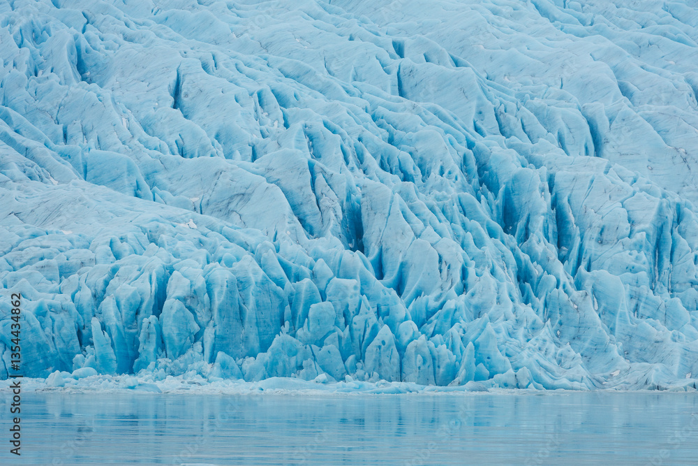 Glacial mountains in Iceland, showcasing rugged peaks and icy landscapes. A breathtaking view of nature's raw power, shaped by time and elements. Perfect for travel, adventure, and nature themes.