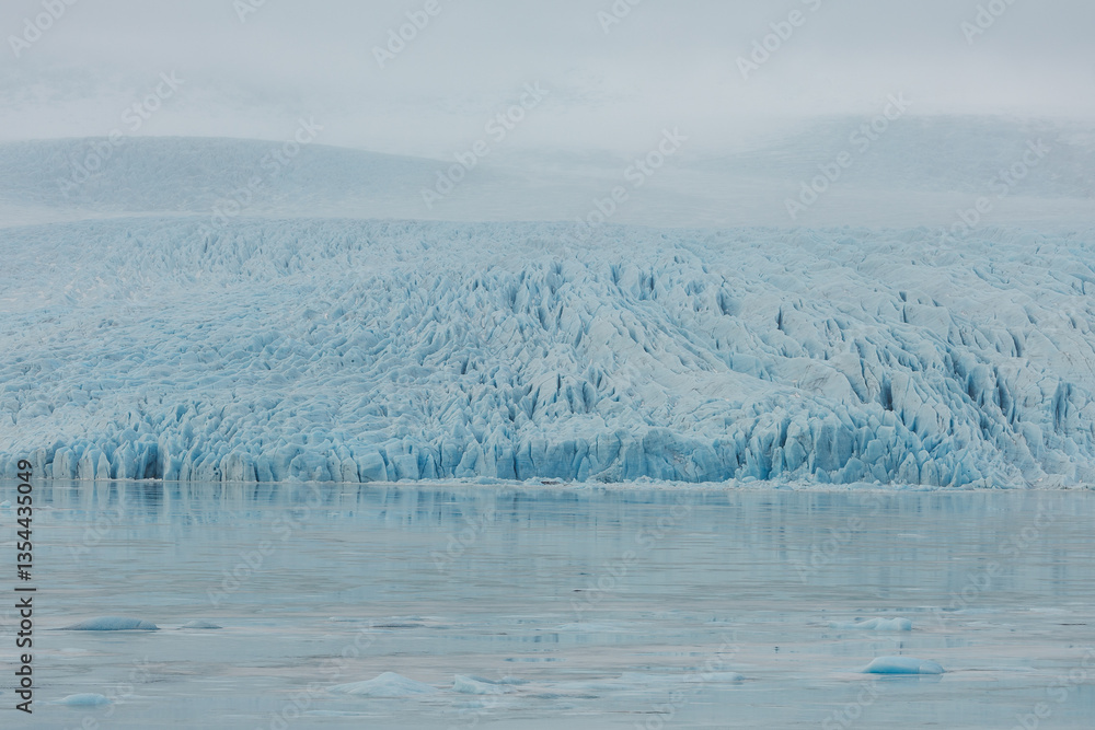 Glacial mountains in Iceland, showcasing rugged peaks and icy landscapes. A breathtaking view of nature's raw power, shaped by time and elements. Perfect for travel, adventure, and nature themes.