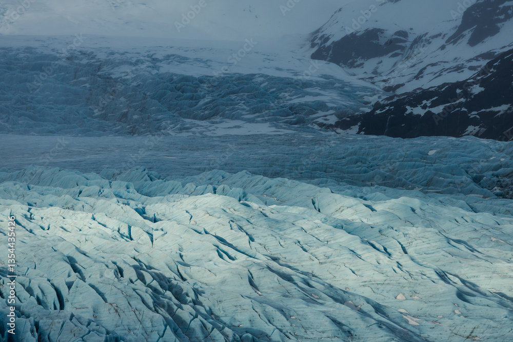 Glacial mountains in Iceland, showcasing rugged peaks and icy landscapes. A breathtaking view of nature's raw power, shaped by time and elements. Perfect for travel, adventure, and nature themes.