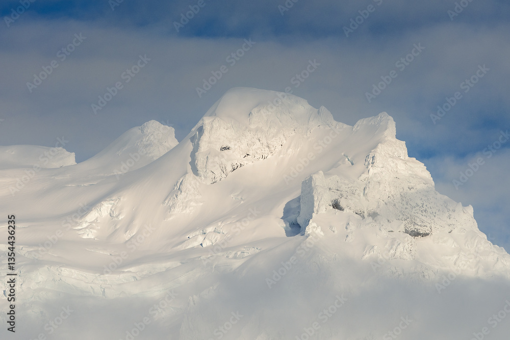 Glacial mountains in Iceland, showcasing rugged peaks and icy landscapes. A breathtaking view of nature's raw power, shaped by time and elements. Perfect for travel, adventure, and nature themes.