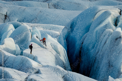 Obraz na płótnie Explore thrilling activities on Iceland’s glaciers: ice hiking, glacier climbing, ice caving, snowmobiling, and glacial lagoon tours. A perfect adventure for thrill-seekers and nature enthusiasts. w salonie