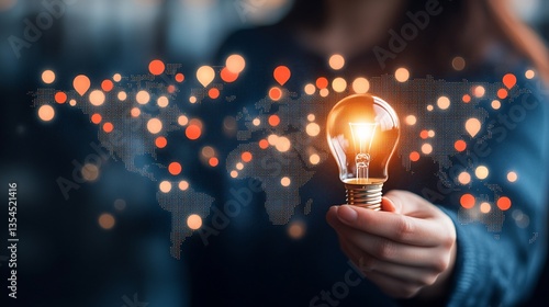Woman holding illuminated lightbulb over world map, symbolizing global idea