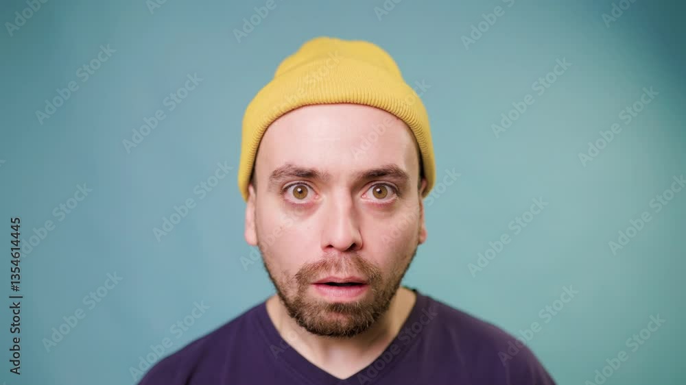 A man with an amazed expression, his face showing astonishment at something unexpected A man with an amazed expression, his face showing astonishment at something unexpected