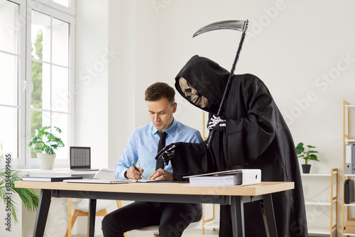 Obraz na plátně Businessman sits in an office, signing a contract to sell his soul to the grim reaper