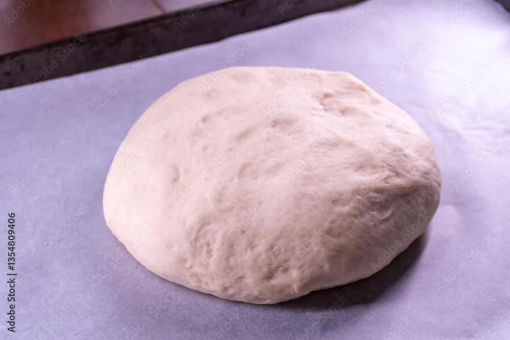 Yeast dough in a bowl. Cooking process. Selective focus Yeast dough in a bowl. Cooking process. Selective focus