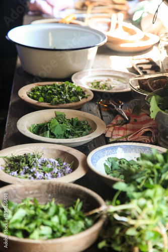 Freshly collected herbs for cooking in old bowls