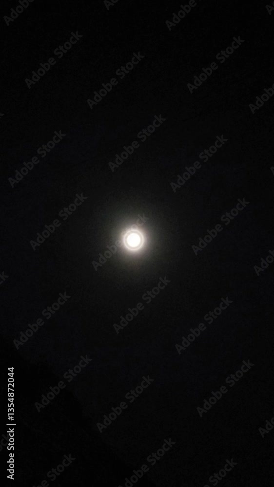 Shining bright moon in the dark night sky. Shining bright moon in the dark night sky.