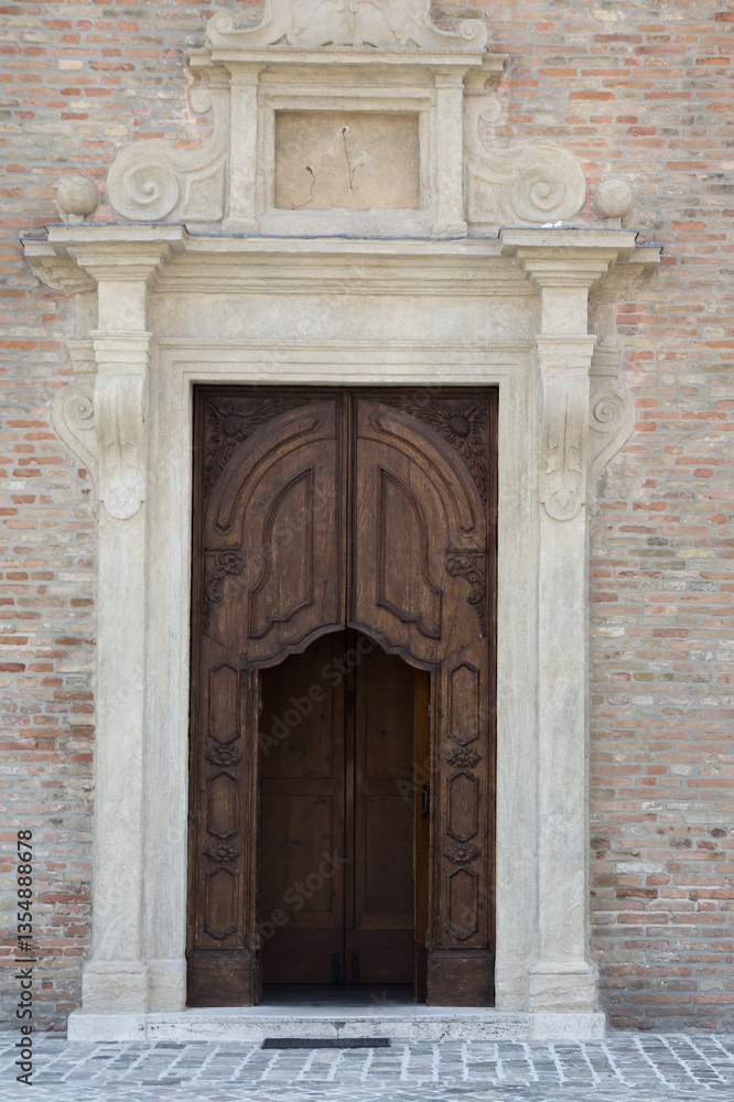 A dramatic shot of the entrance to a historic church in Rimini, Italy. A dramatic shot of the entrance to a historic church in Rimini, Italy.