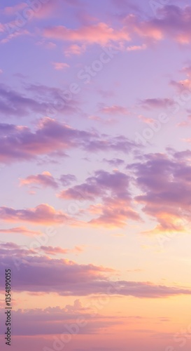 Beautiful pastel sunset sky with soft clouds in shades of pink, purple, and orange, creating a serene and dreamy atmosphere, perfect for backgrounds and artistic inspiration.