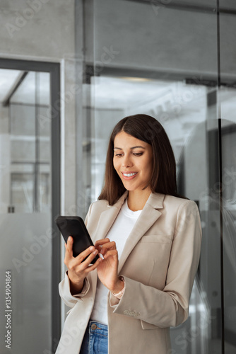Latin or middle eastern professional business woman working on smartphone mobile phone at office. Young businesswoman manager using pc cellphone technology device financial bank application. Vertical Free Download Latin or middle eastern professional business woman working on smartphone mobile phone at office. Young businesswoman manager using pc cellphone technology device financial bank application. Vertical - GFXLoad