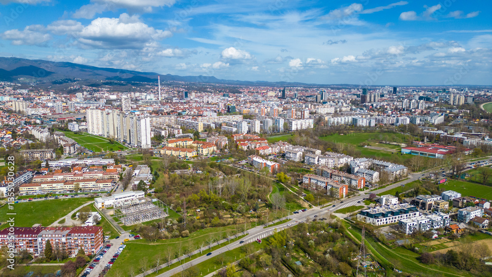 Obraz premium Aerial drone view of Park Jarun in Zagreb, showcasing stunning blue water, lush greenery, and the nearby Sava River Park features excellent bicycle roads, perfect for cycling and outdoor activities