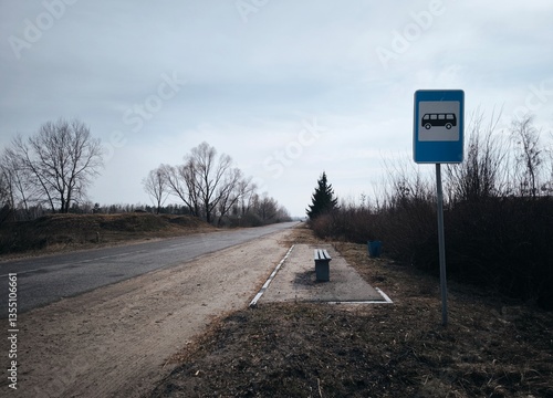 Bus stop located on a side road somewhere in the countryside. Spring season. Bus stop in the countryside on the highway. dark landscape