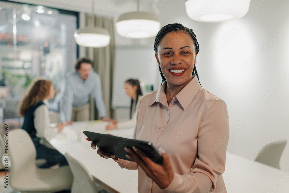 Fototapeta premium Confident businesswoman leading a team meeting