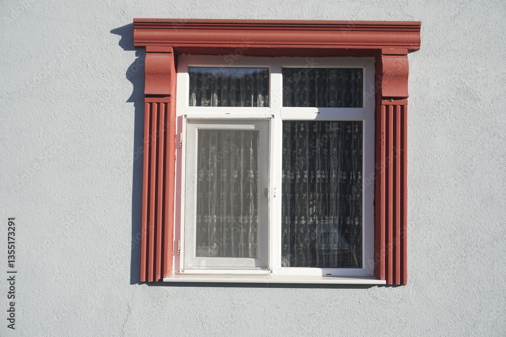 Fototapeta premium Window Framed with Red Decorative Foam Trim