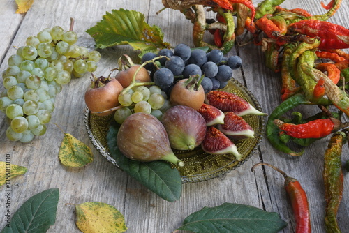 Assorted Fruits and Dried Chilies on a Wooden Plate