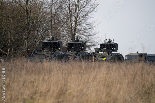 Obraz na płótnie a convoy of British Army Alvis Stormer Starstreak CVR-T tracked armoured vehicle equipped with short range air defense high-velocity missile system w salonie